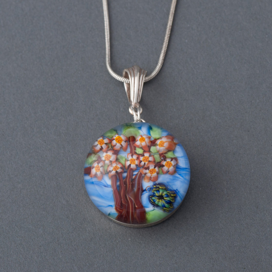 This Artisan Cherry Tree and Butterfly Lampwork Flamework glass pendant necklace